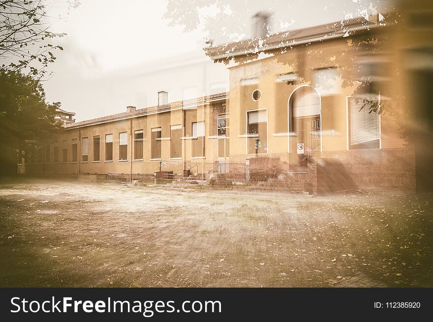 External facade of old and abandoned devastated school in double exposition composition, ready for renovation. External facade of old and abandoned devastated school in double exposition composition, ready for renovation