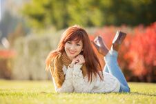 Young Pretty Woman Relaxing In The Park Stock Image