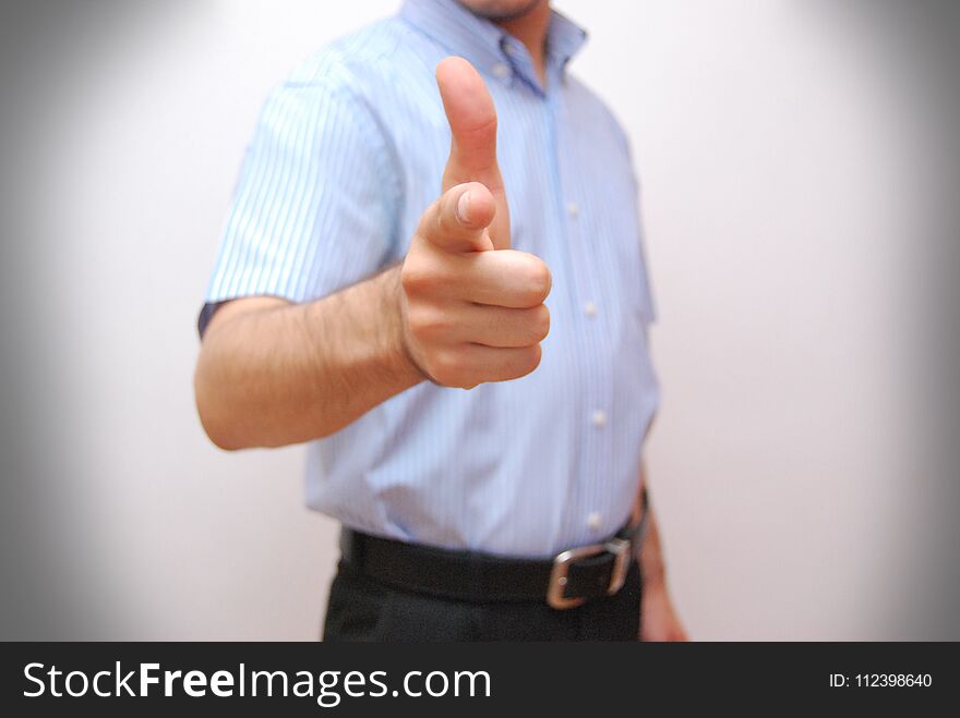 Businessman is touching futuristic screen with finger.