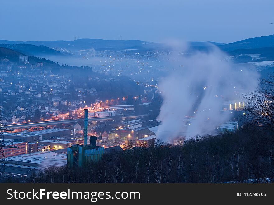 German Landscape at Siegen-Geisweid during early morning season after the sun rising. Cold weather during winter showing a mixture out of heavy industries and housing areas in a valley