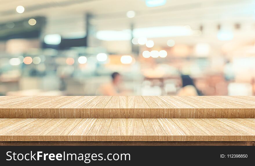 Empty step plank wood table top food stand with blur cafe restaurant background bokeh light,Mock up for product display or montage of design,Banner for advertise on online media,business presentation