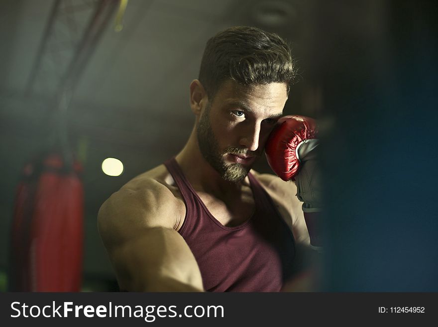 Close-up Photography of Man Wearing Boxing Gloves