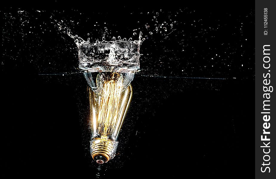Photography of Light Bulb on Body of Water