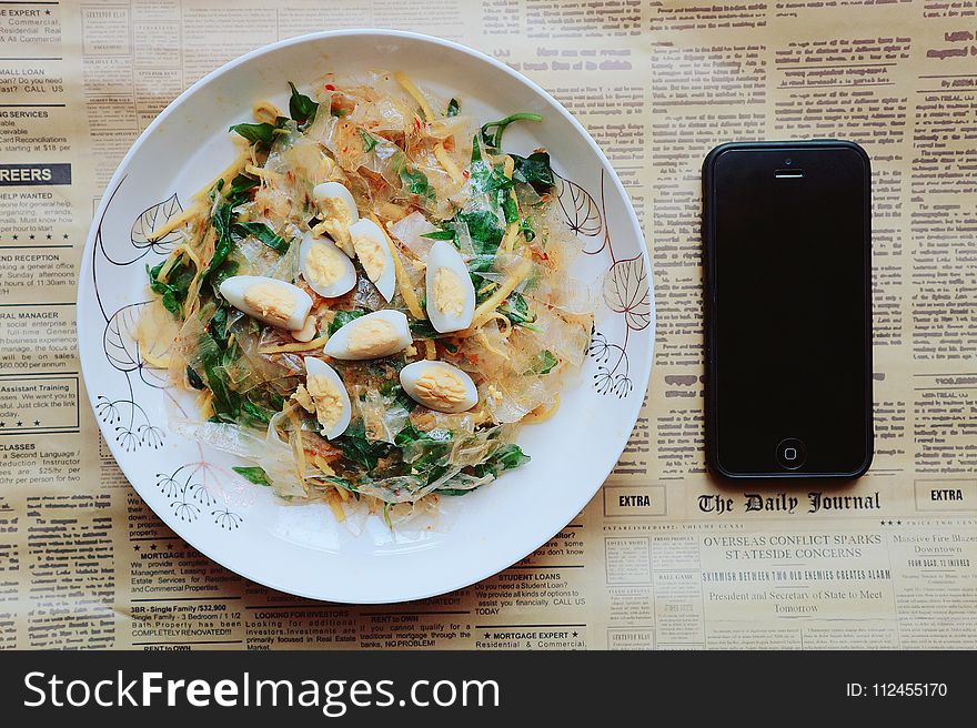 Black Iphone 5 Near Plate Of Pasta Dish