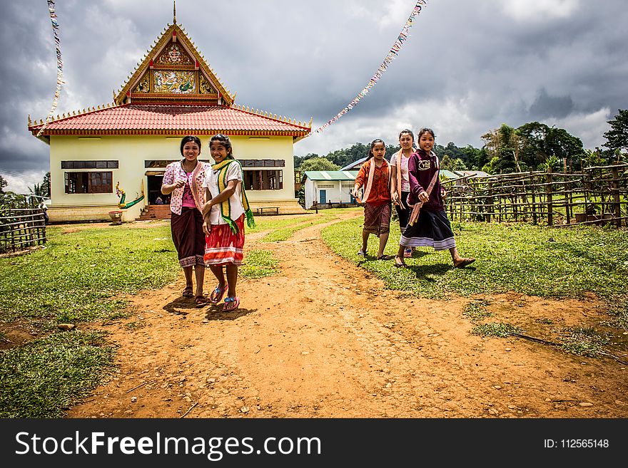 Five Women Walking On Green Grasses