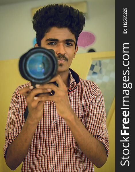 Man Holding Dslr Camera