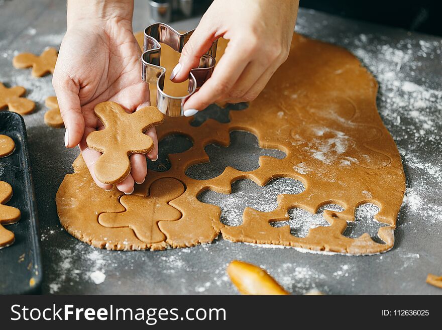 Female Hands Making Festive Christmas Gingerbread Cookies