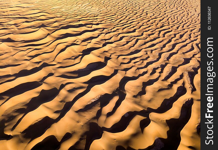 Aerial top view on sand dunes in desert