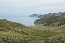Lake Baikal, Beautiful Blue Water And Green Hills Royalty Free Stock Photography
