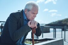 Upset Old Man Thinking About Something Outdoors Stock Images