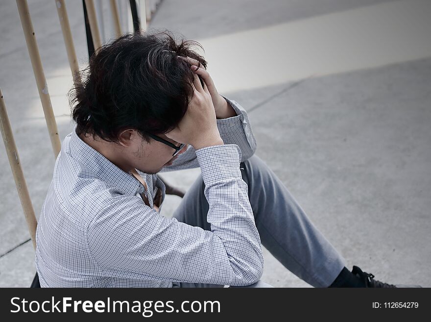 Frustrated Stressed Young Asian Business Man Feeling Disappointed Or Exhausted With Job At Outside Office.