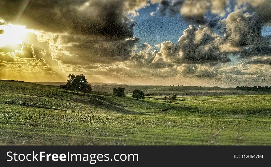 Sunset Over Beautiful Green Hills And Trees