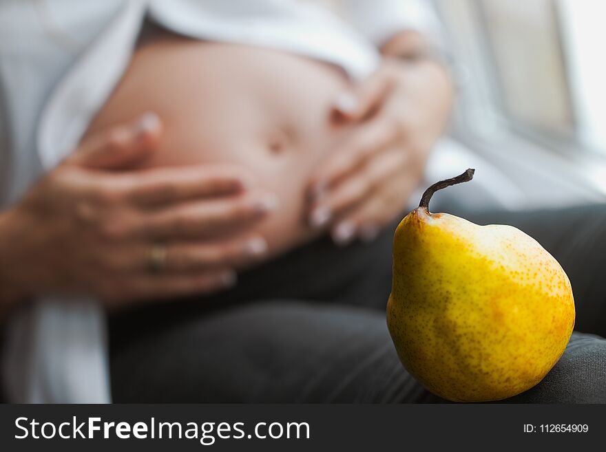 Pregnant woman choosing healthy food.