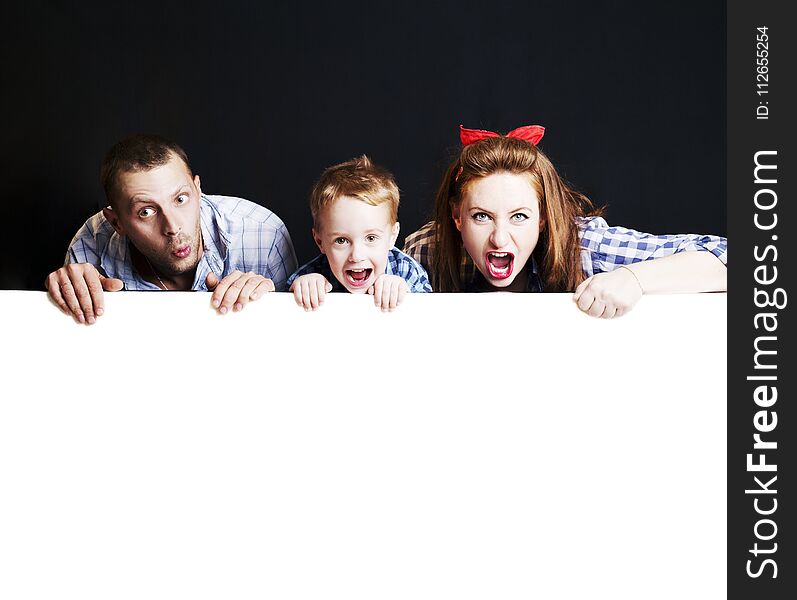 Happy family in the studio on a black and white background.