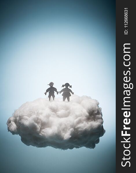 Two children standing on a white cloud. Eternal life. Christianity. Salvation concept.