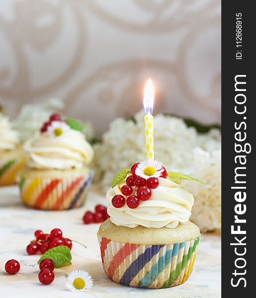 Gentle Cupcake With Cream And Berries Nd A Candle A Light Background