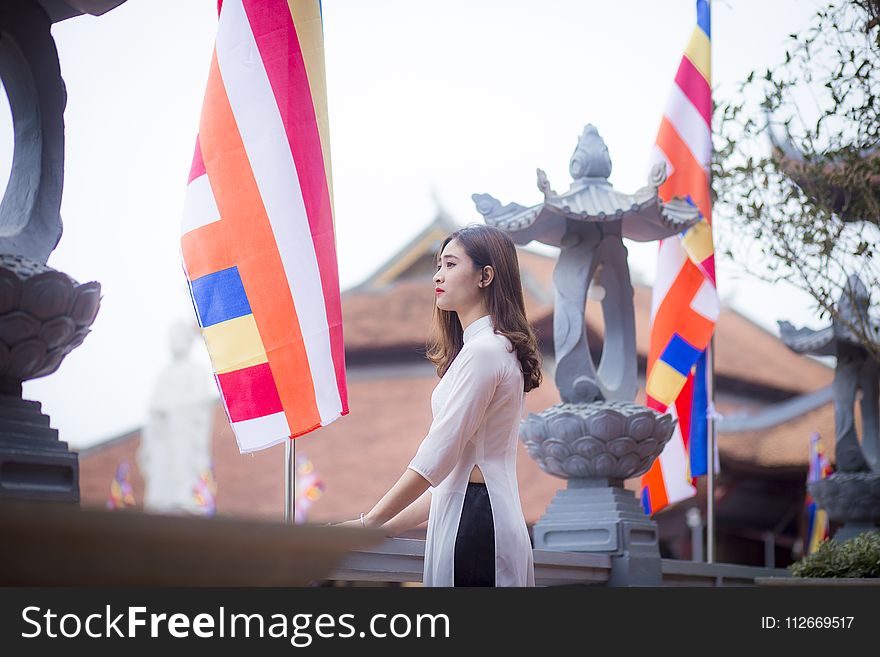 Photo Of Woman Standing On Bridge