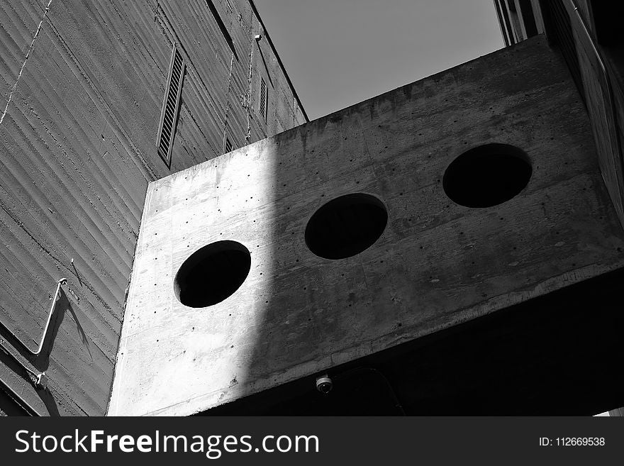 Grayscale Photography of Board With Three Round Holes