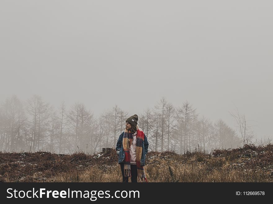 Person In Brown And Red Scarf