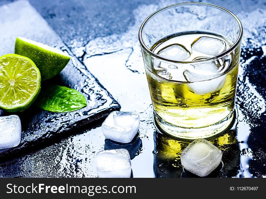 Glass Of Whiskey On Dark Background