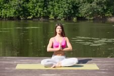 Young Girl Practices Yoga On The Shore Of The Lake, The Concept Of Enjoying Privacy And Concentration, Sunlight Royalty Free Stock Image Young Girl Practices Yoga On The Shore Of The Lake, The Concept Of Enjoying Privacy And Concentration, Sunlight Royalty Free Stock Image