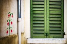 Closed Window With Green Shutters And Painted Wall Of Old House Stock Photos Closed Window With Green Shutters And Painted Wall Of Old House Stock Photos