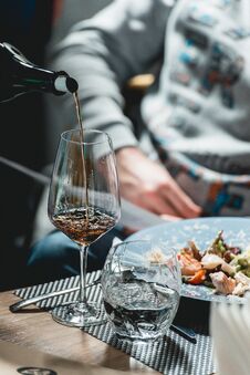 Sommelier Pouring Wine Into Glass At Wine Tasting Stock Photos Sommelier Pouring Wine Into Glass At Wine Tasting Stock Photos