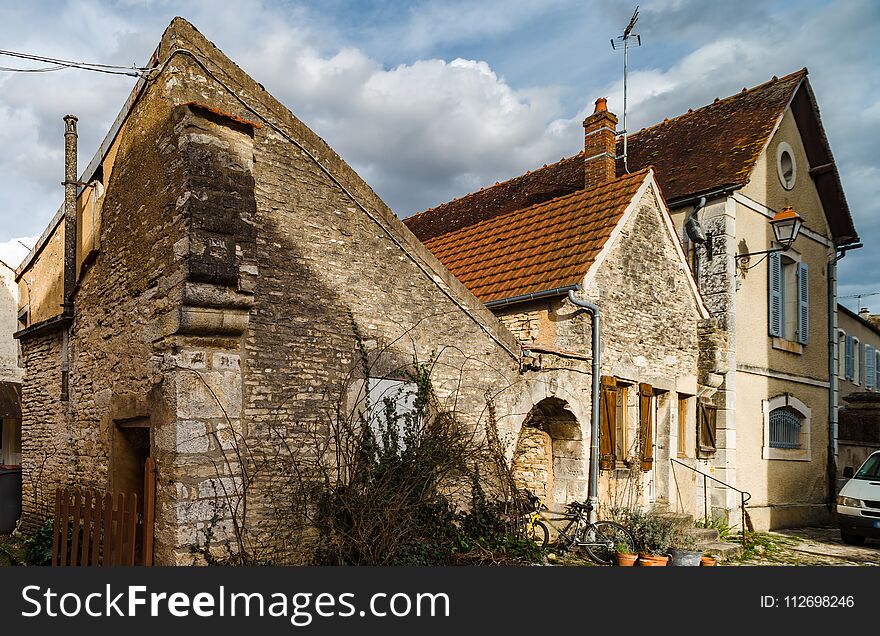 Old medieval houses on the cobbled street in ancient french village Noyers