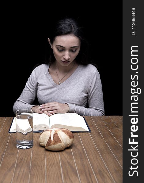 Young Woman Doing Fasting And Prayer