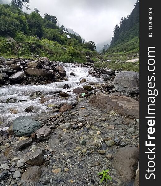 A great view of river flowing in barot valley himachal pardesh. A great view of river flowing in barot valley himachal pardesh