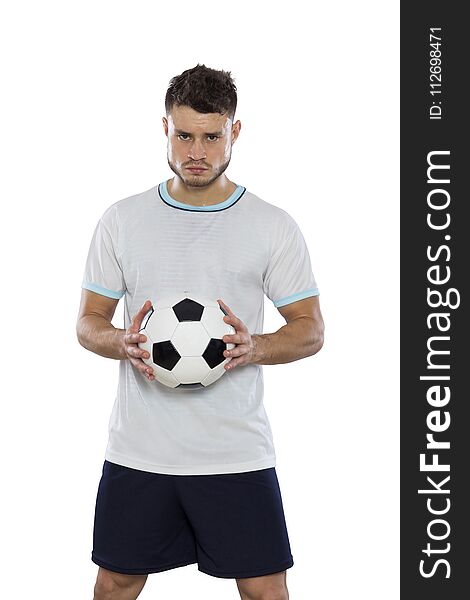 Young soccer player on grass with white shirt and ball in hands on white background