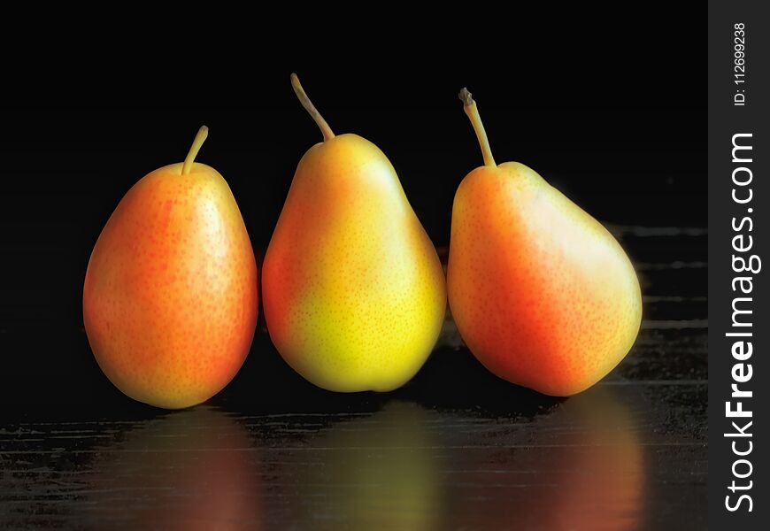 Yellow Pears On The Black Backgrpund