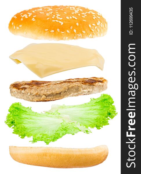 Delicious hamburger with flying ingredients on white background.