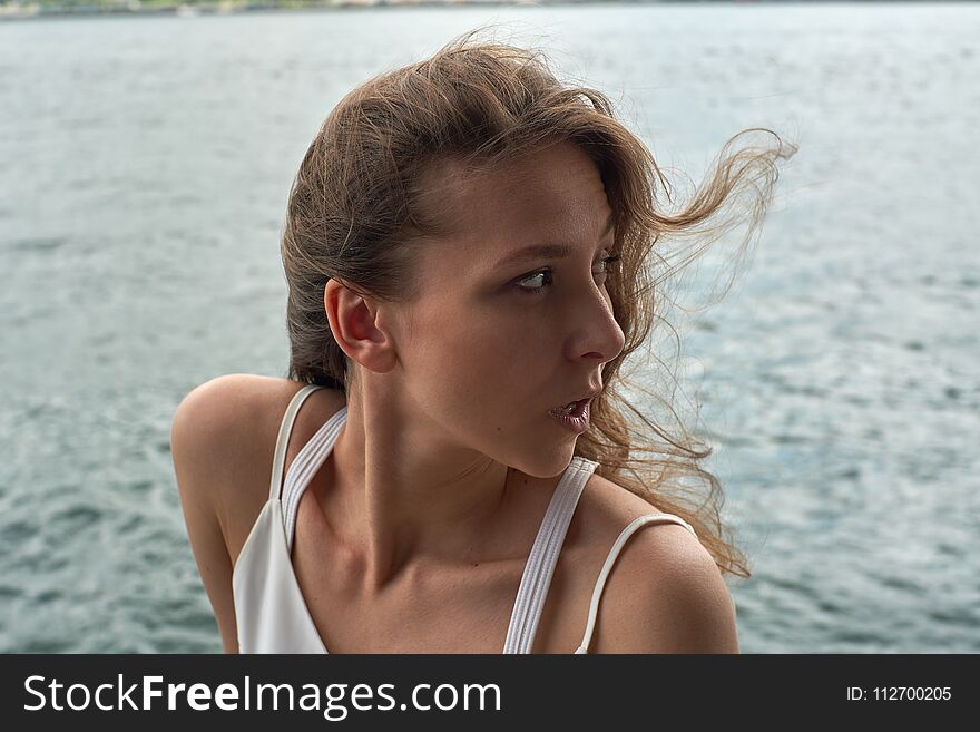 Beautiful Young Girl With Brown Hair And Awesome Eyes On The Ocean Beach In The Metropolis Hong Kong