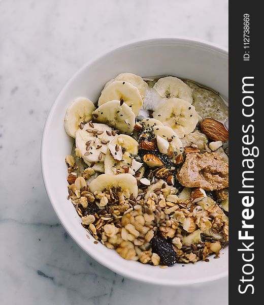 Cereal With Banana On White Bowl