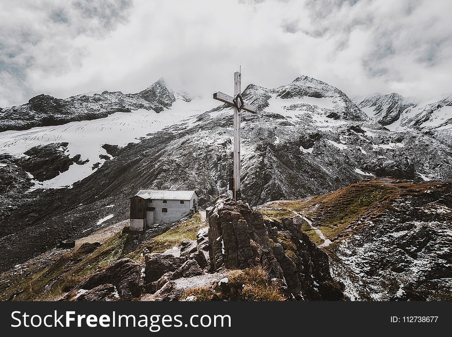 Landscape Photo of White Cross on Mountain