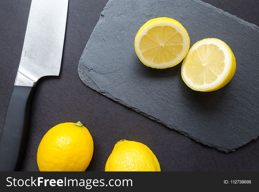 Sliced Lemons on Black Surface