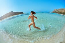Woman Running On The Beach Stock Image