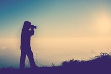 Silhouette Of Female Photographer Standing Focus For Take A Photo Royalty Free Stock Photography