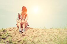 Young Hipster Woman Sitting On The Sand And Carrying Backpack Fe Stock Image Young Hipster Woman Sitting On The Sand And Carrying Backpack Fe Stock Image