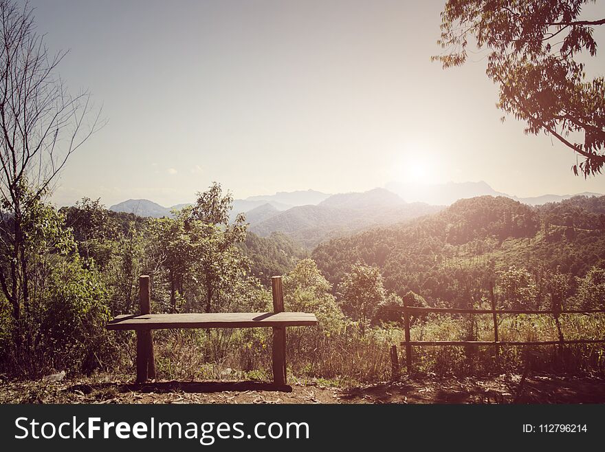 Wooden bench with beautiful mountain view and background