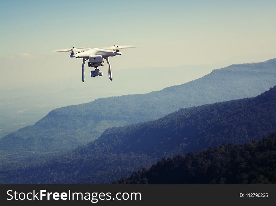 Flying Drone With Camera On The Mountain