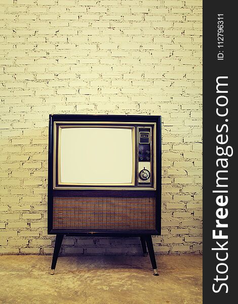 Retro tv with brick wall background
