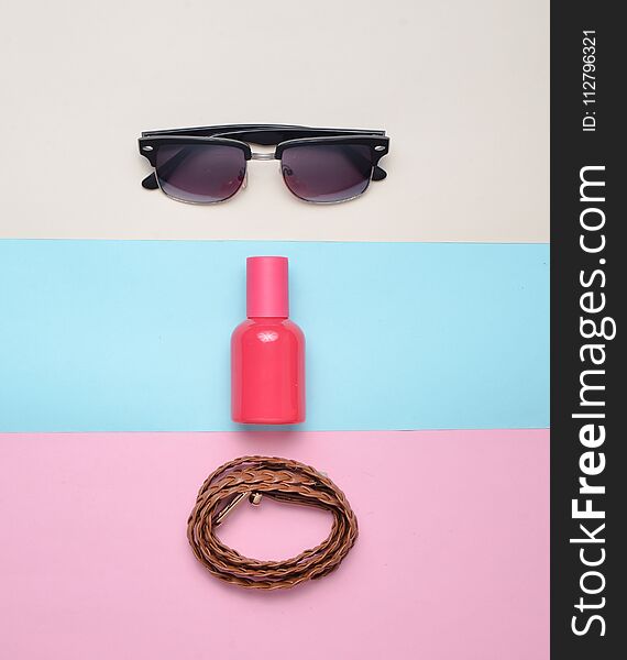 Women& X27;s Trendy Accessories On A Multicolored Pastel Background. Glasses, Perfume, Leather Belt. Top View. Minimalism