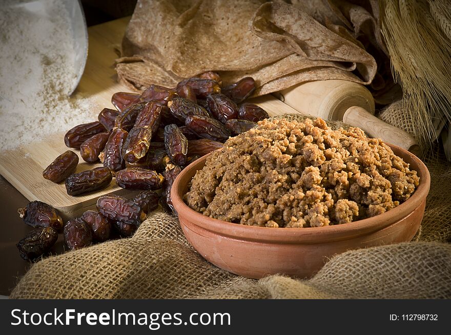 Hunaini, Saudi Arabian Traditional Sweets Made of Dates and Saj Bread Still life with Ingredients