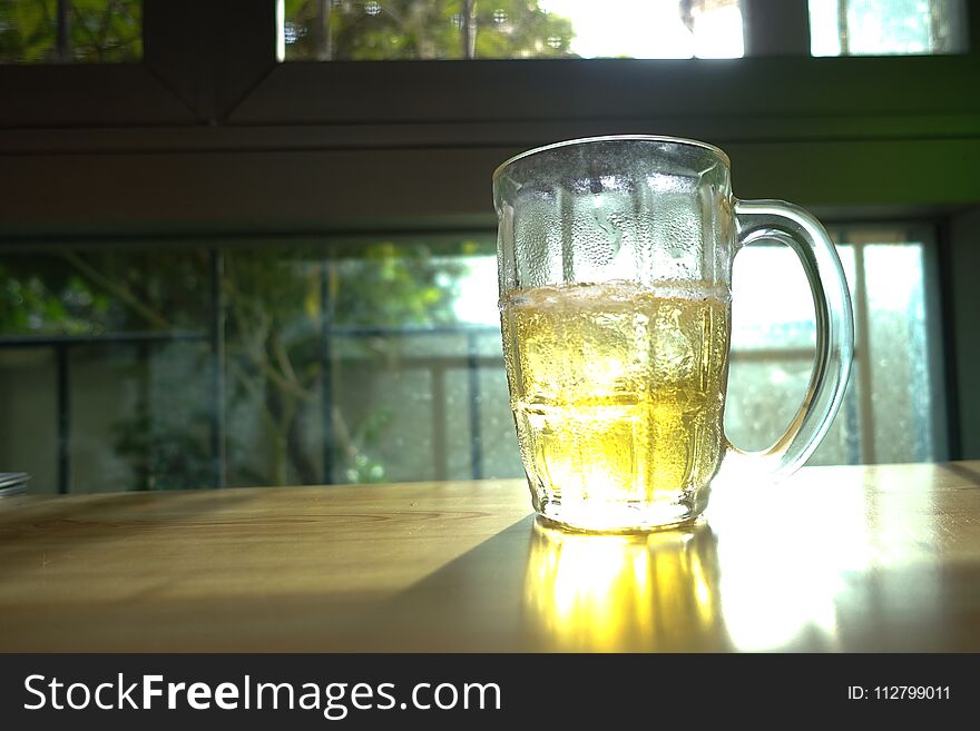 Beer Glass on Wood Table