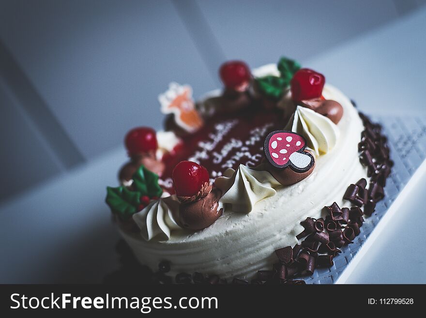 Chocolate and Vanilla cake with topping on table,Close up