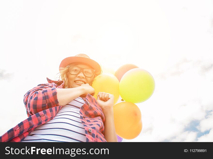 Teenage Girls Holding Colorful Balloons In The Bright Sky And Sm