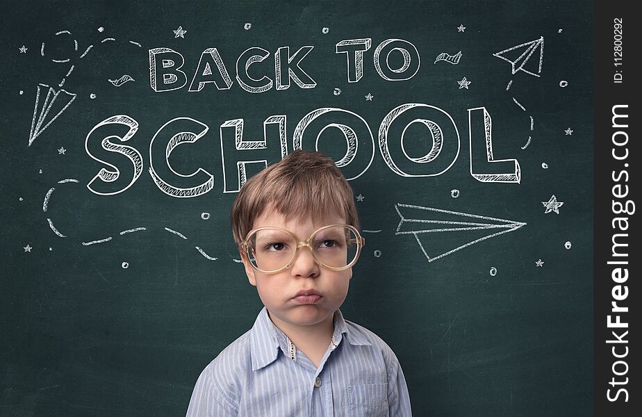 Adorable little boy with blackboard and back to school concept. Adorable little boy with blackboard and back to school concept