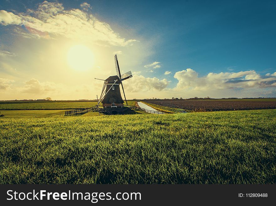 Vintage Black Windmill during Sunset